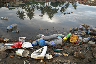 According to the world bank in a preliminary report findings on poverty calculates the poverty line at 0.88 cents a day whilst 49.9% people live below poverty line in Timor-Leste. Most waste is dumped directly onto pavements and garbage are seldom collected. Rivers filled wih plastic will spill the waste near and into the sea. Photo by Martine Perret/UNMIT 3 December 2008